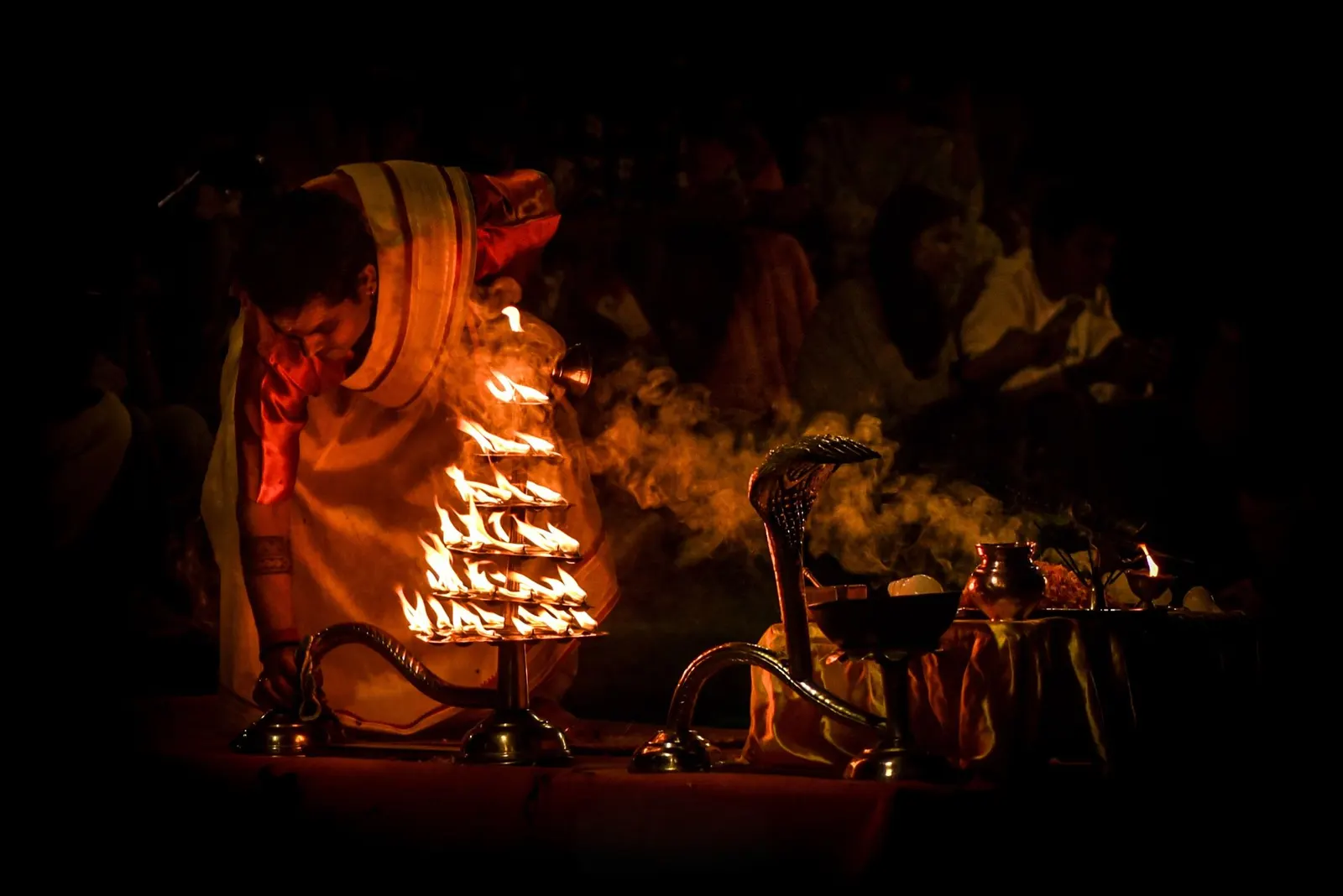 The Kaal Bhairav temple in Varanasi lit with lamps at night.