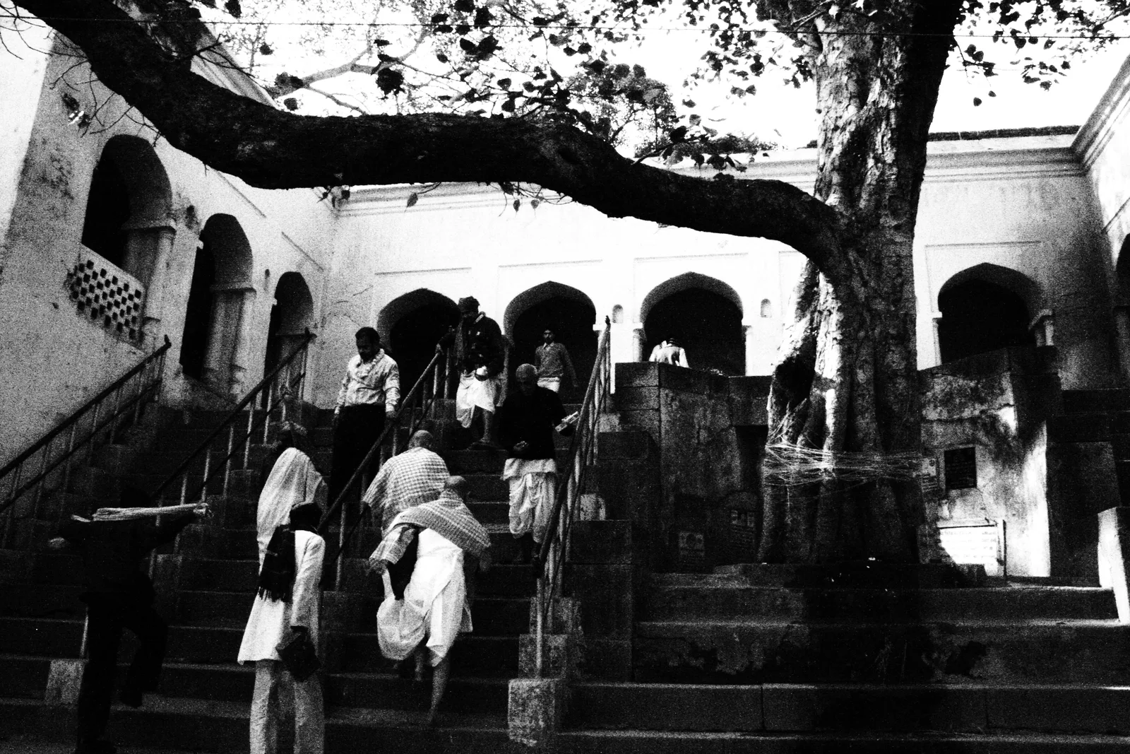 Pilgrims walking on stone steps at the Vishnupad Temple in Gaya, Bihar.